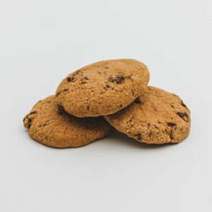 An image of three Jon Jon Gluten Free Choc Chip biscuits with one stacked on top