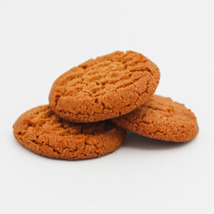 Three Simply The Best Gingernuts stacked on one another looking delicious