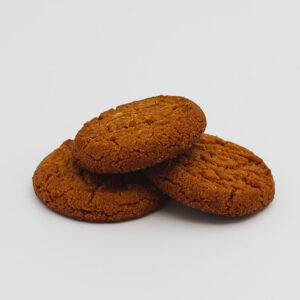 Three Kaye's Bakery Gingernut Biscuits with one stacked on top